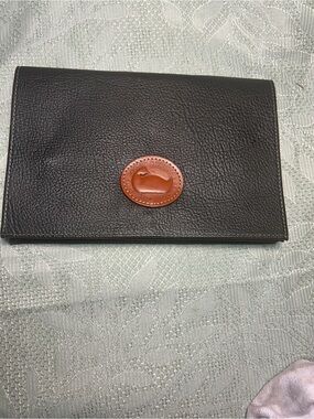 Dooney & Bourke Black Leather Clutch with Brown Logo Patch